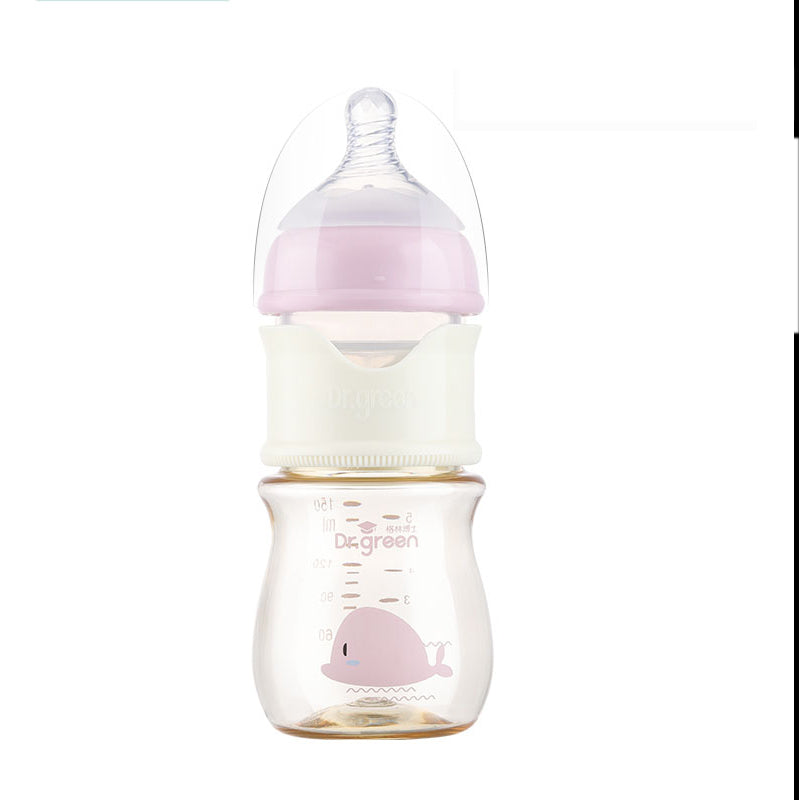 Baby bottle with pink cap and whale design on a white background
