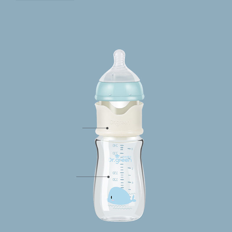 Baby bottle with whale design on a light blue background