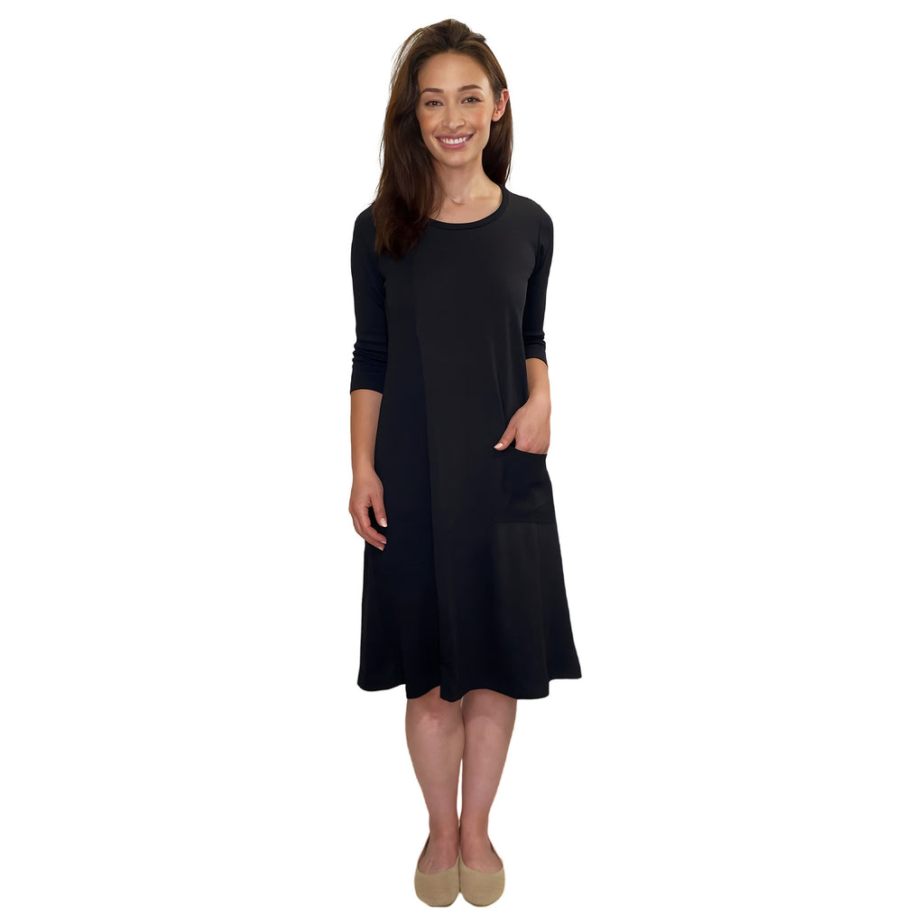 Woman wearing a black dress on a white background