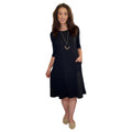 Woman wearing a black dress with a white background