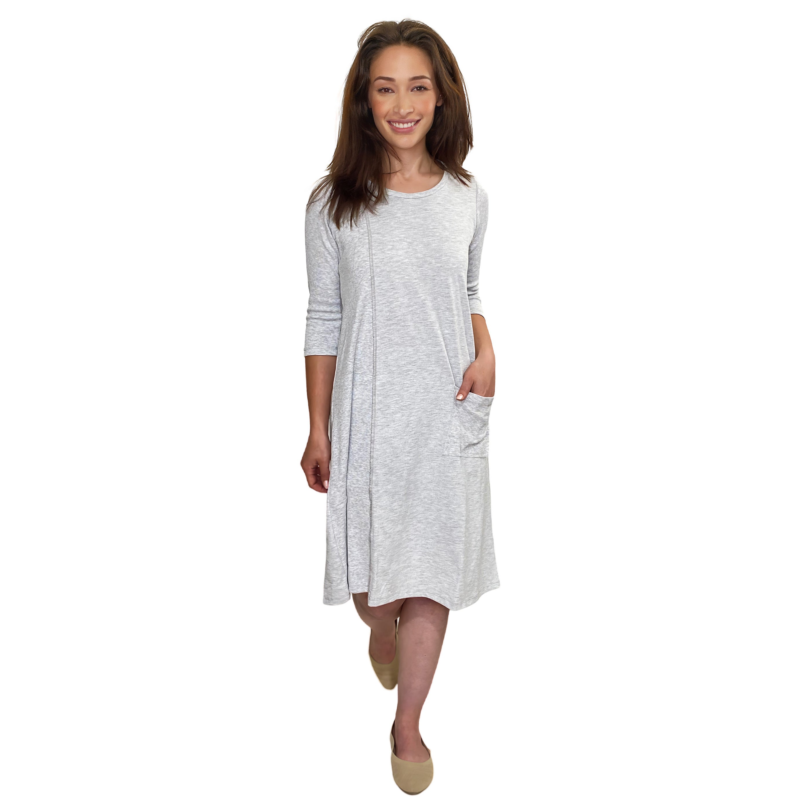Woman wearing a gray dress on a white background