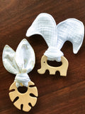 Baby beech wood teether with organic cotton fabric tie — natural, safe chew toy for teething infants
