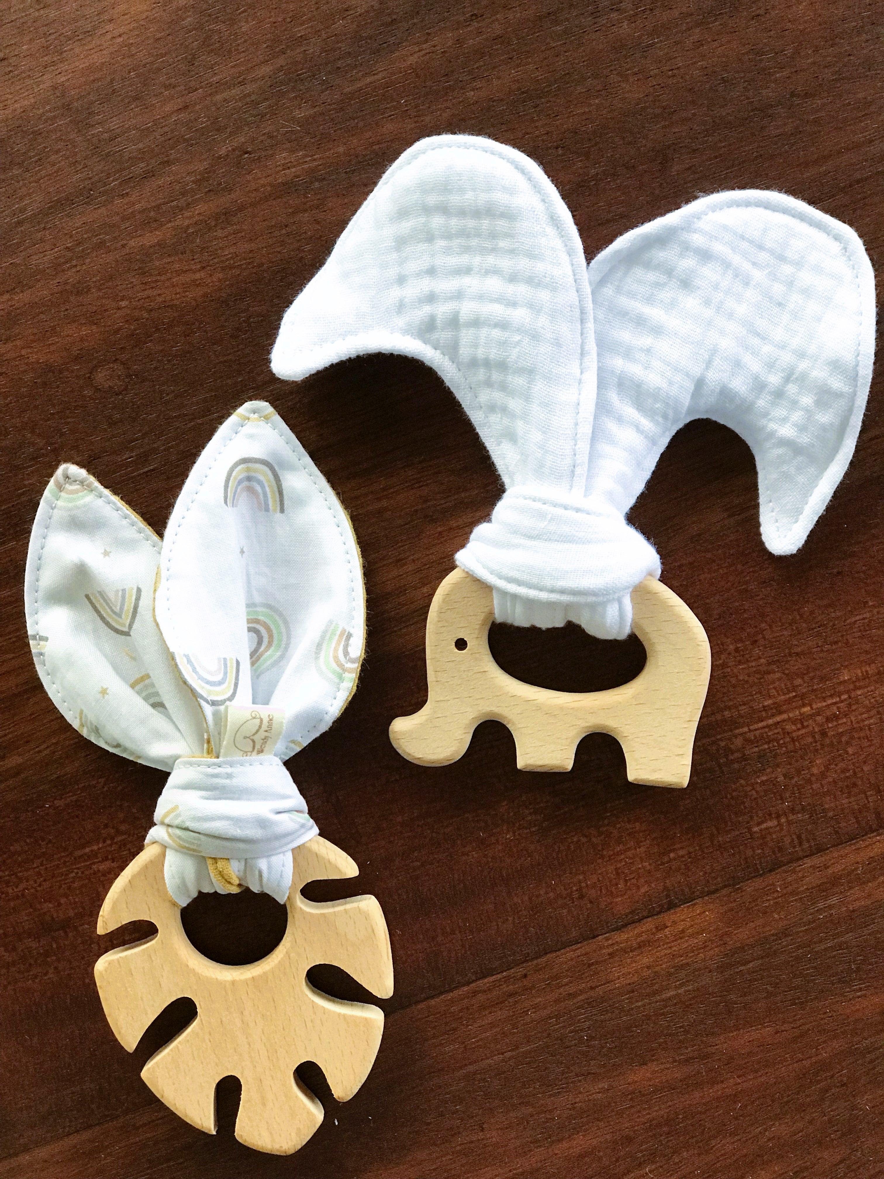 Baby beech wood teether with organic cotton fabric tie — natural, safe chew toy for teething infants