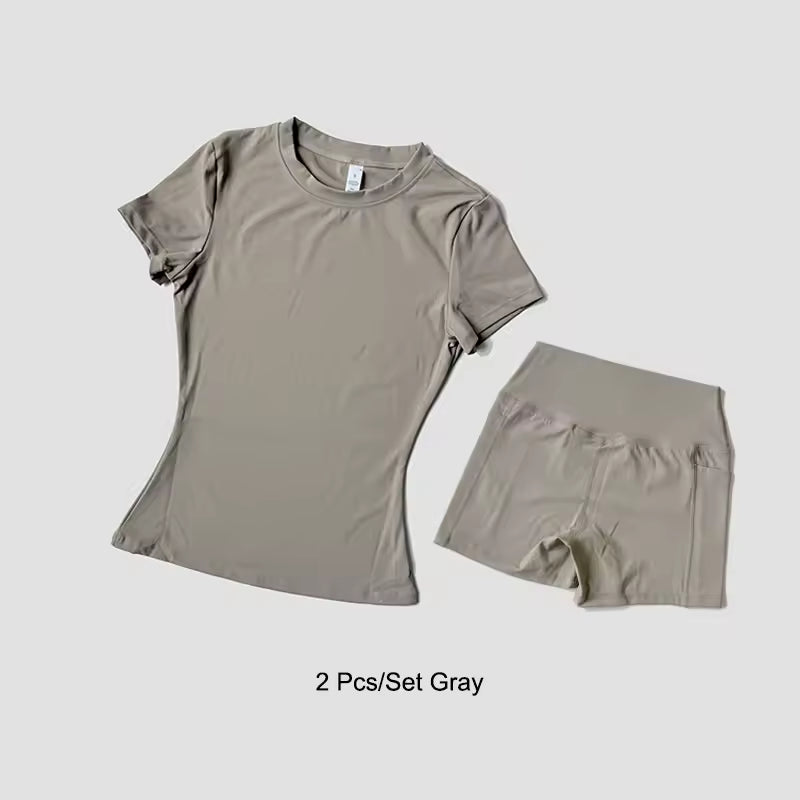 Gray t-shirt and shorts set on a light gray background