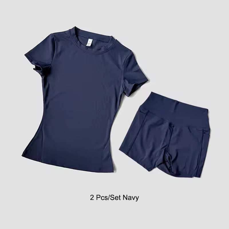 Navy blue t-shirt and shorts set on a light gray background