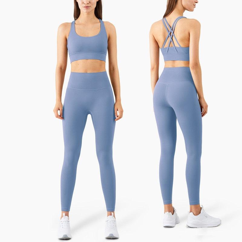 Woman wearing a blue athletic outfit from front and side views on a white background