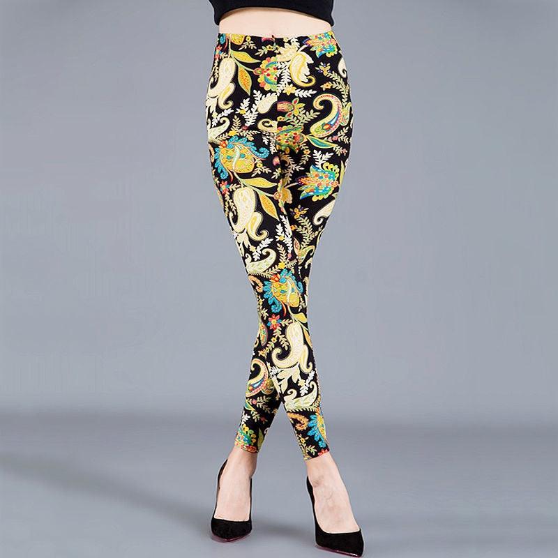 Colorful patterned pants worn by a person on a gray background