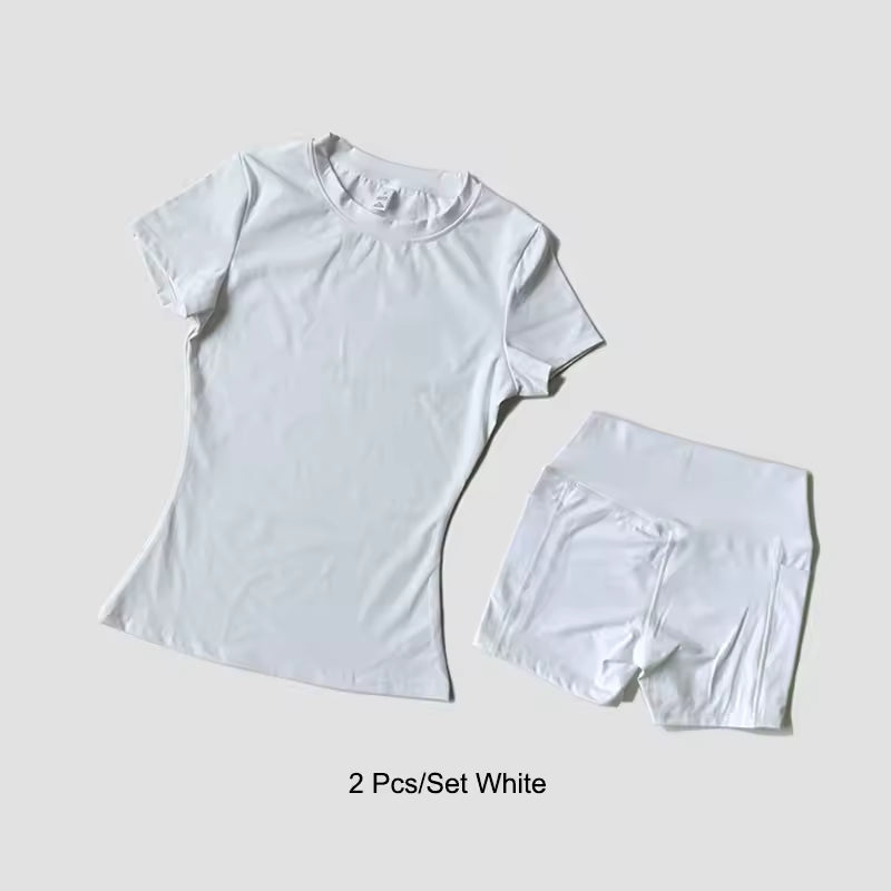 White t-shirt and shorts set on a light gray background